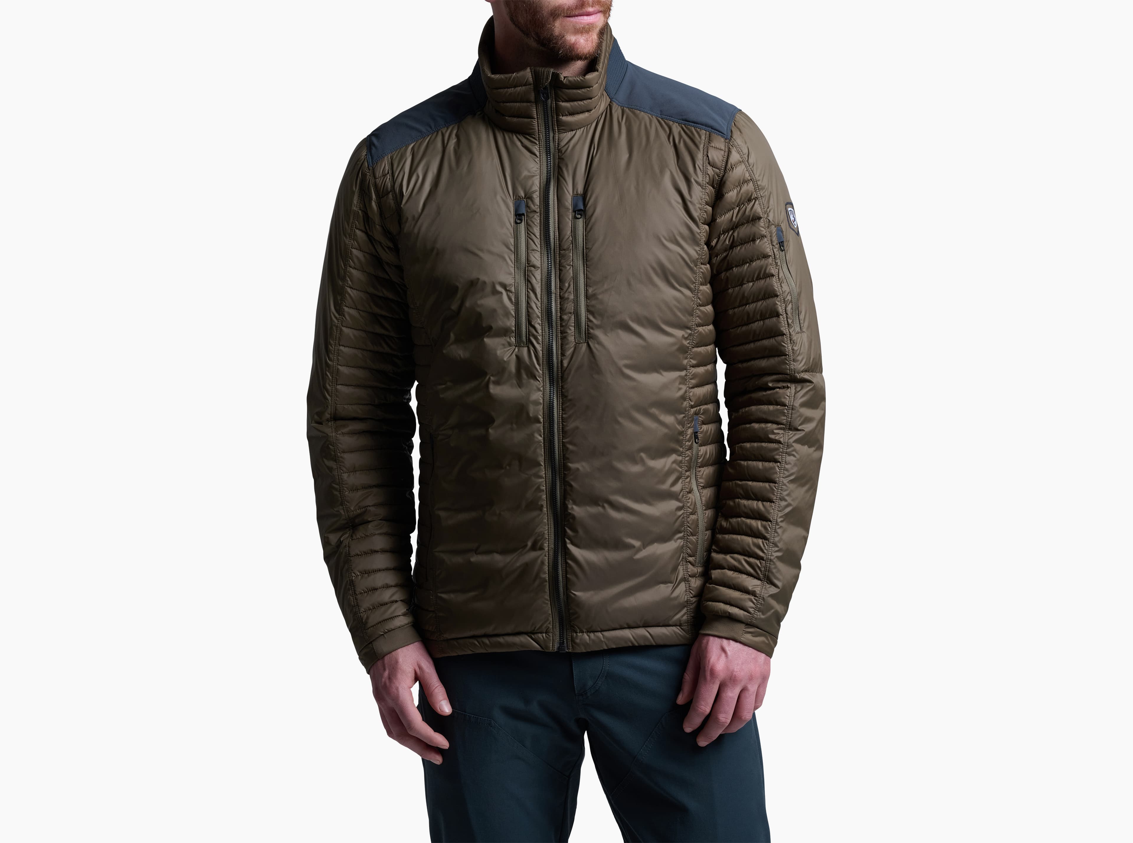 KUHL Spyfire Down Jacket in dark color, front view showing quilted baffles and reinforced shoulder overlays