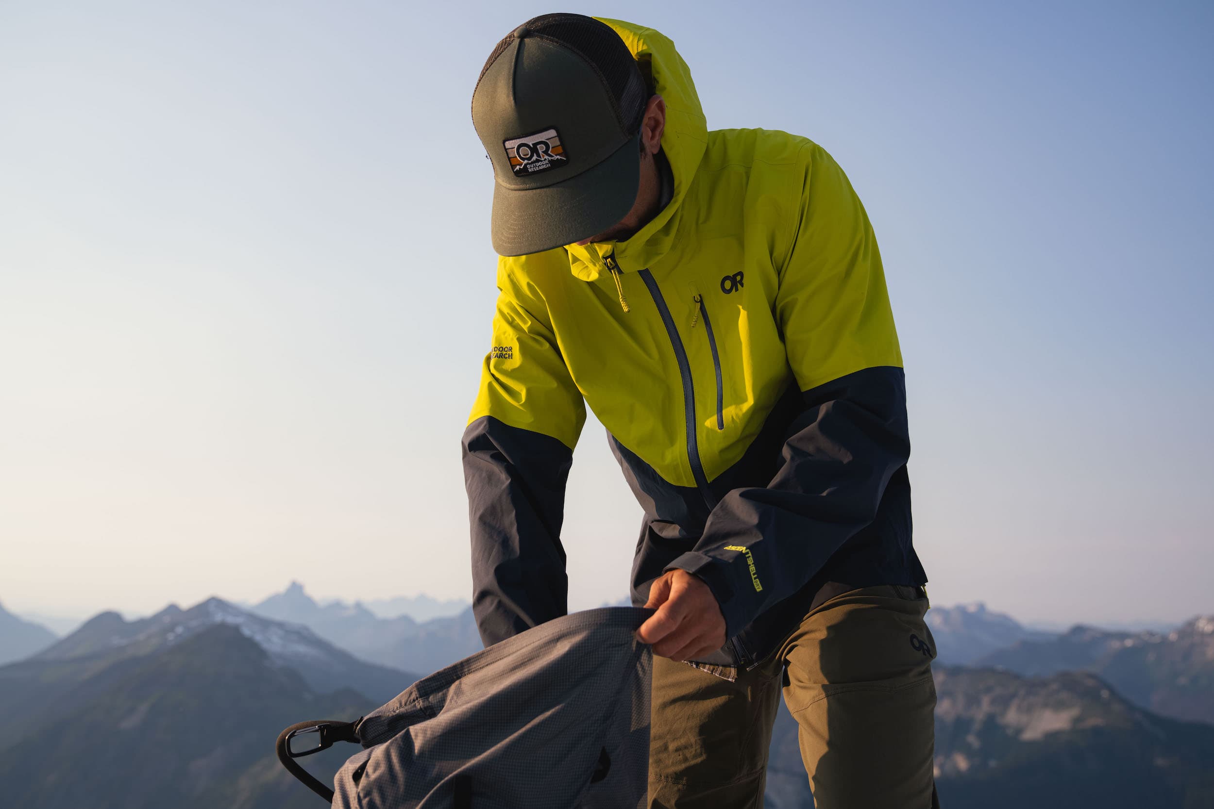 Outdoor Research Foray 3L men's rain jacket showing hood and TorsoFlo side venting zippers